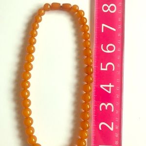 Like new.  AMBER NATURAL STONE